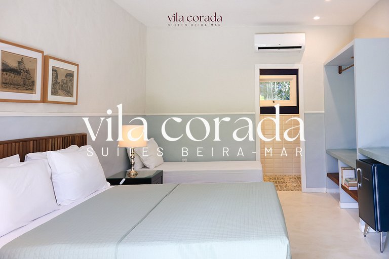 Suite tripla charmosa frente jardim