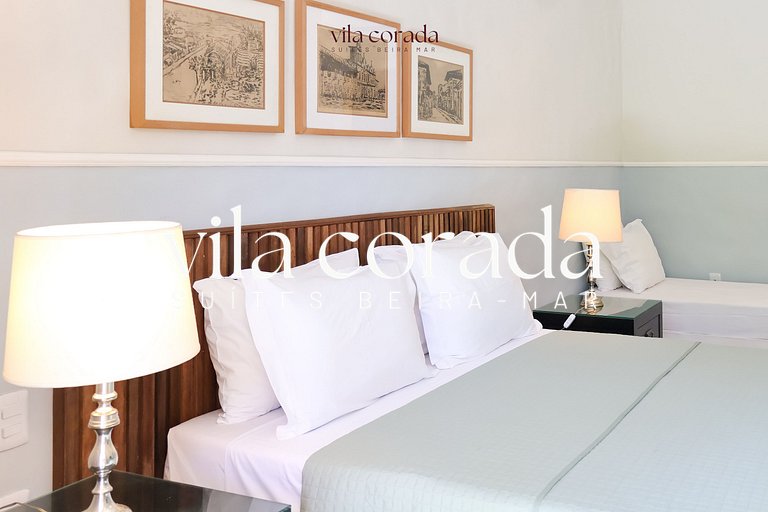 Suite tripla charmosa frente jardim